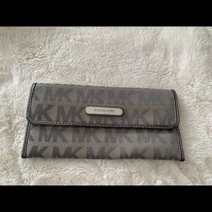 Gently used gray/silver Michael Kors wallet